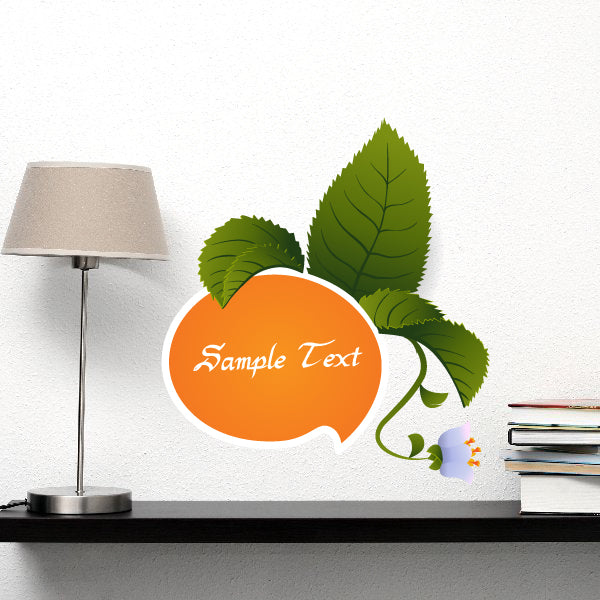 Orange speech-bubble text sticker with green citrus leaves and white outline.