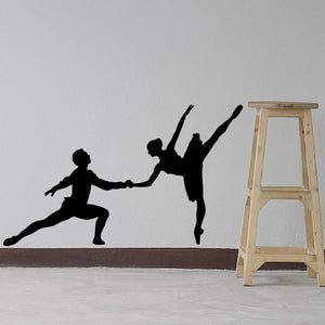 Ballet dancer wall decal of two silhouettes in high-leg balance pose