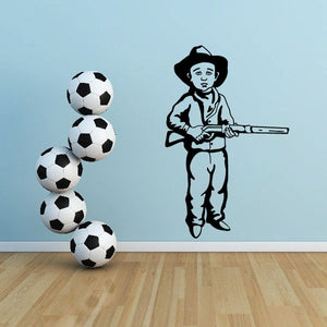 Cowboy kids wall decal with standing cowboy holding gun and cluster of soccer balls