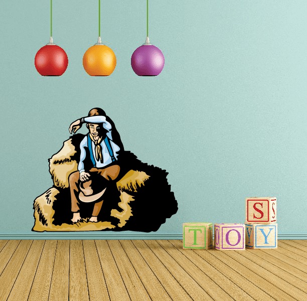 Cartoon cowboy resting, hat at knee, with block letters TOY sticker