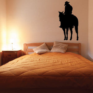 Black cowboy on horseback wall decal in silhouette