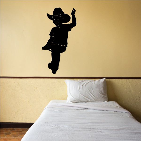 Cowboy wall decal with black silhouette figure and raised arm