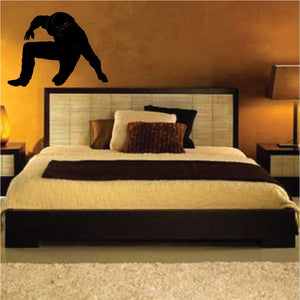 Cowboy wall decal vinyl sticker with black silhouette of a crouching rider and hat