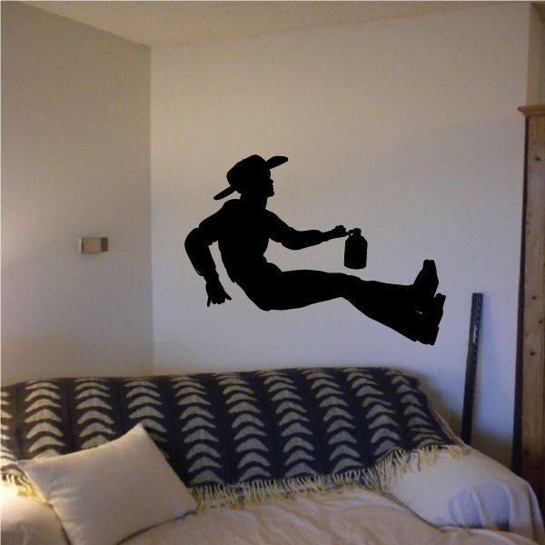Black cowboy silhouette wall decal, leaning back with hat and boots