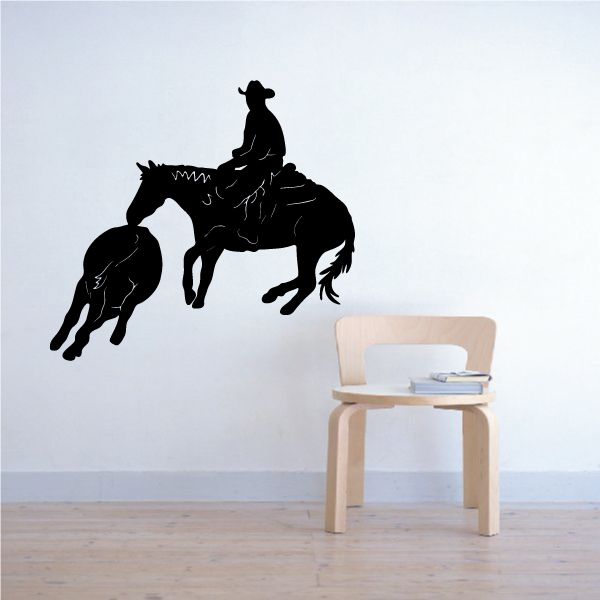 Black cowboy riding horse vinyl wall decal with lasso and spurs silhouette