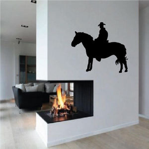 Cowboy riding horse vinyl wall decal in dark silhouette