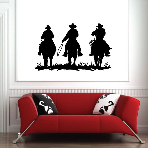 Cowboy wall decal with three black silhouette riders on grass and boots