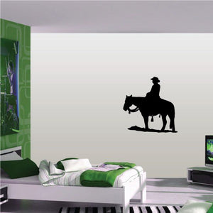 Cowboy wall decal of black cowboy riding horse silhouette