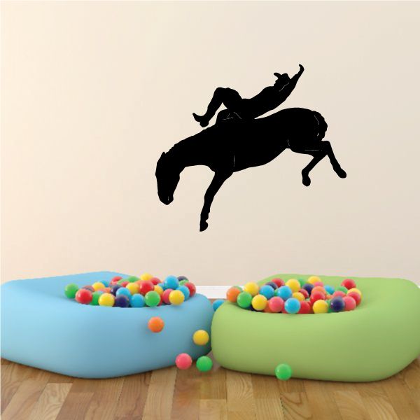 Cowboy wall decal in black: cowboy riding horse silhouette