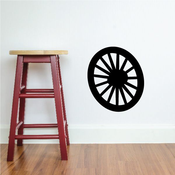 Black and white target-style vinyl wall decal with circular spokes
