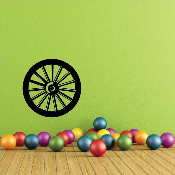 Circular target wall decal with multicolor balls along the bottom