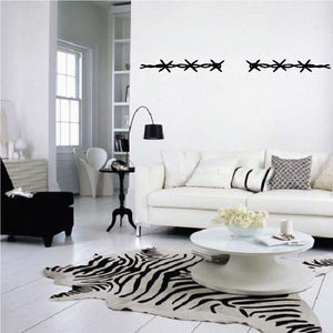 Cowboy wall decal with two rows of black star-and-swirls across the wall