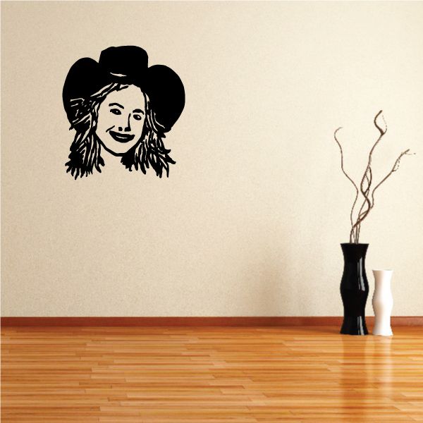 Cowgirl wall decal: black vinyl silhouette of a cowgirl face with hat and long hair