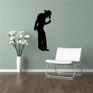 Black cowgirl silhouette wall decal in cowboy hat, holding reins
