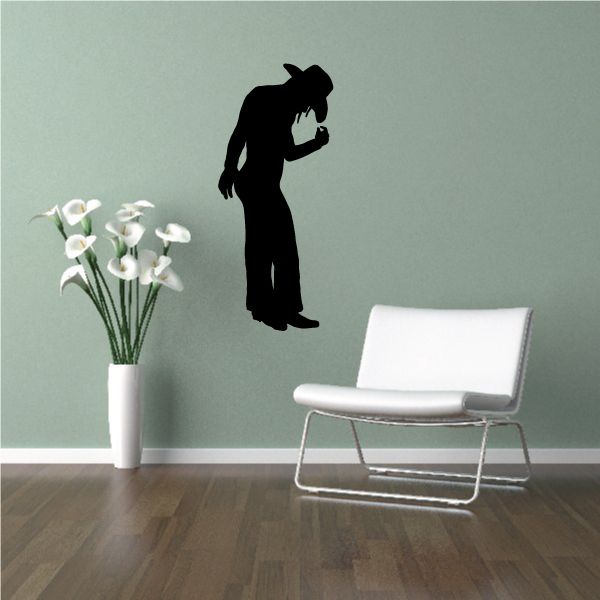 Black cowgirl silhouette wall decal in cowboy hat, holding reins