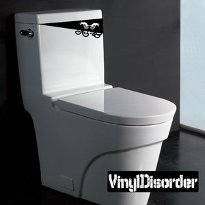 Creepy toilet monster decal on white toilet tank lid, black graphic