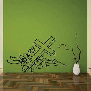 Decorative cross wall decal with flowers, leaves, and ribbon-like accents