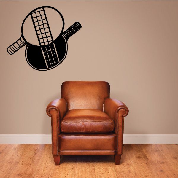 Crossed ping pong racket decal with black rackets and grid paddles