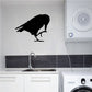 Black crow grooming silhouette wall decal, perched with claws extended above sink