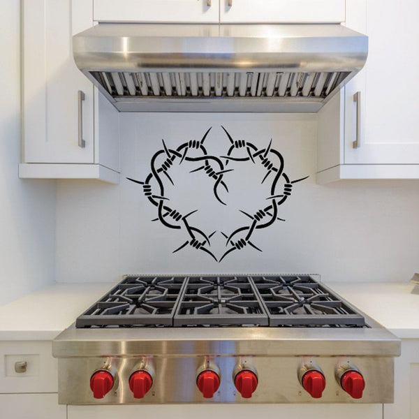 Black crown-of-thorns heart decal with outlined thorn rays on smooth surface