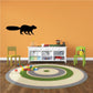 Black squirrel wall decal with small yellow accents