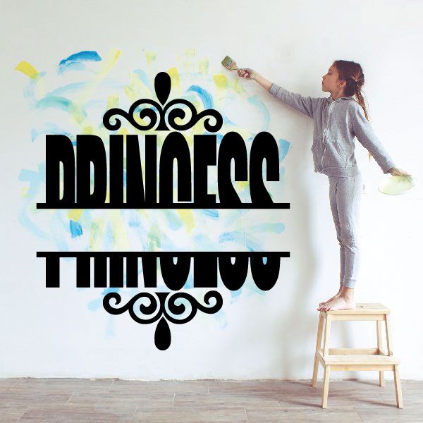 Ornate black vinyl name decal with crown scrollwork, flat on wall
