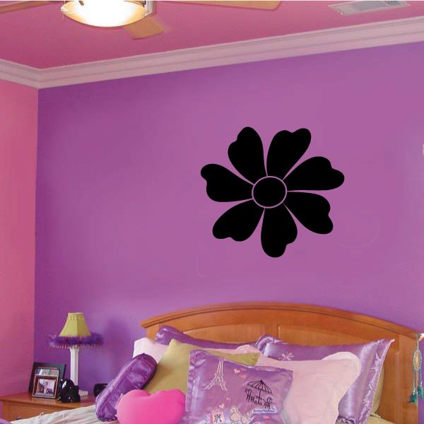 Black daisy flower wall decal with outlined petals and central circle