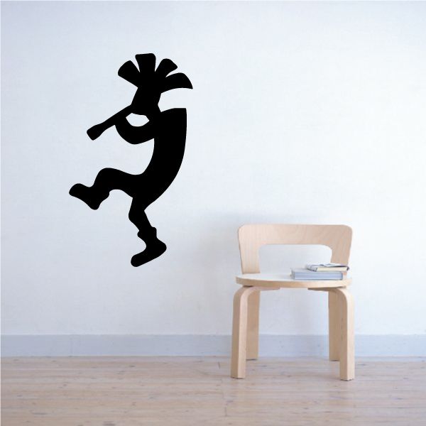 Dancing Kokopelli wall decal, black silhouette figure jumping with raised arms.