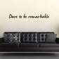 Wall decal with handwritten-style text: “Dare to be remarkable”