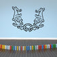 Horned animal decorative decal in black line art with circular center