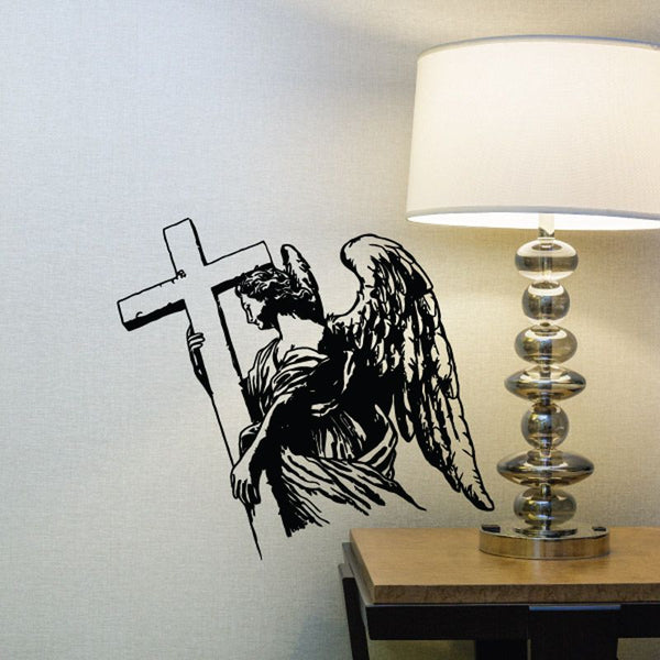 Black angel holding cross decal with detailed wings and robe
