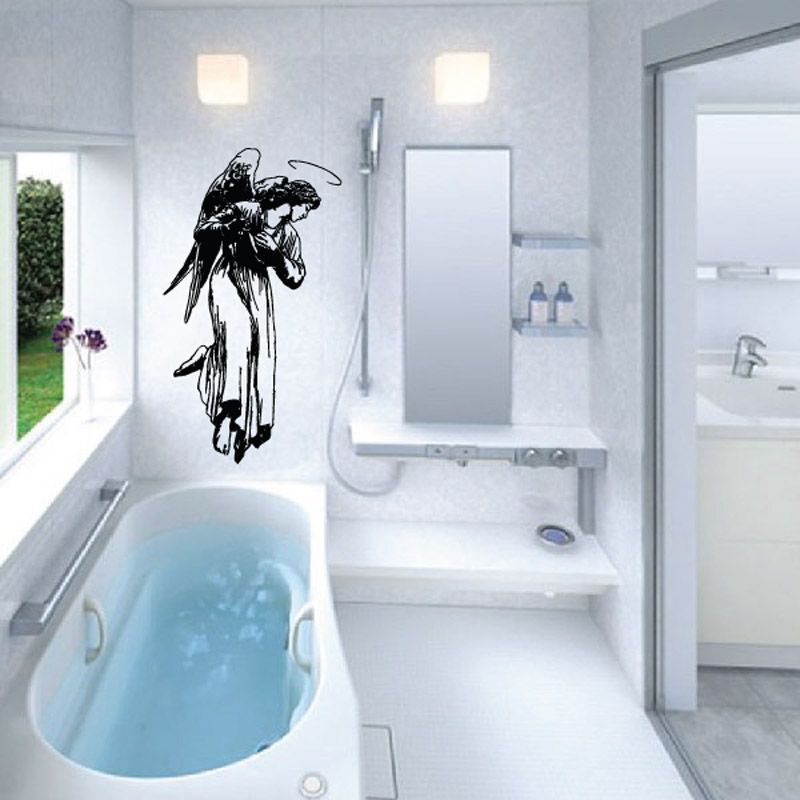 Black angel with halo decal on wall, detailed wings and face