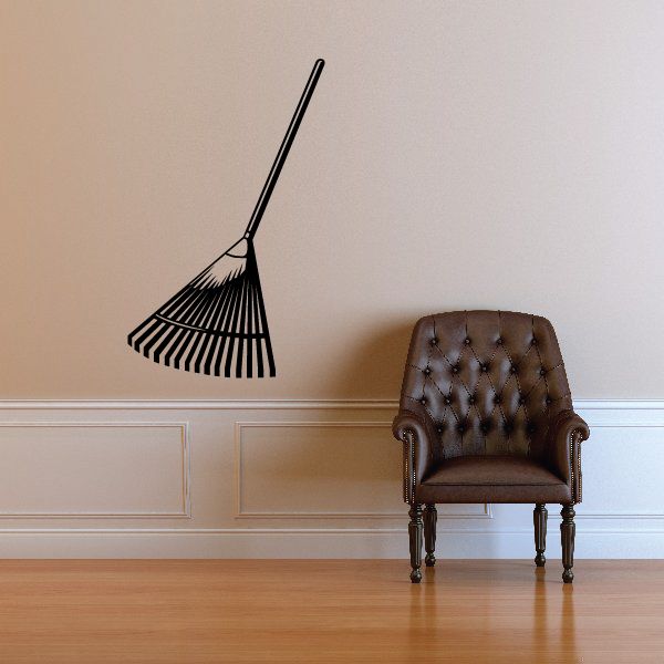 Black gardening rake decal with long handle and fan-shaped head