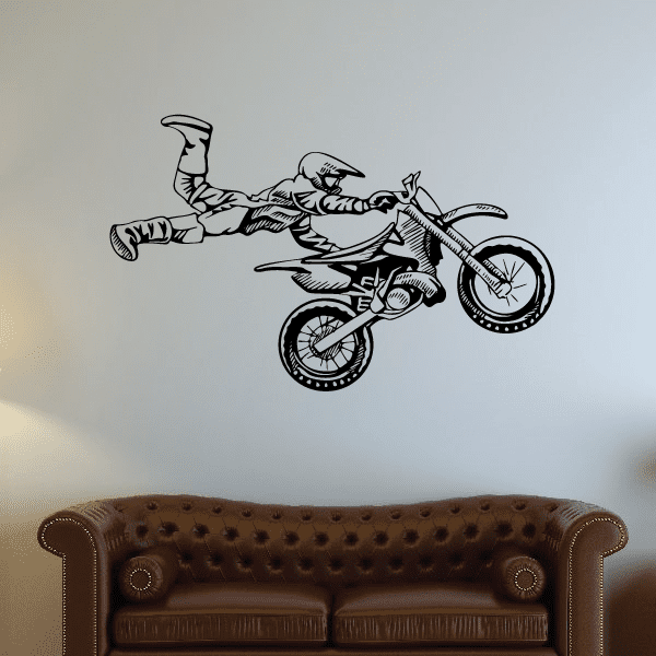 Vinyl dirt bike decal of a rider on a motocross bike, black outline.