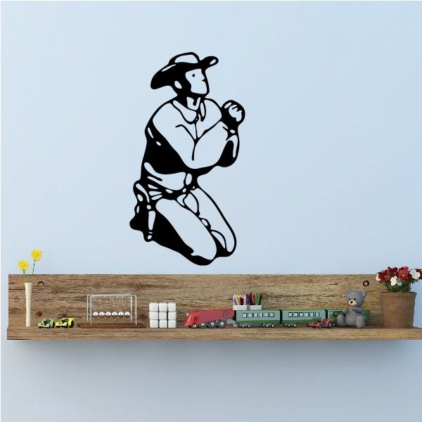 Praying cowboy wall decal with outlined kneeling cowboy holding clasped hands