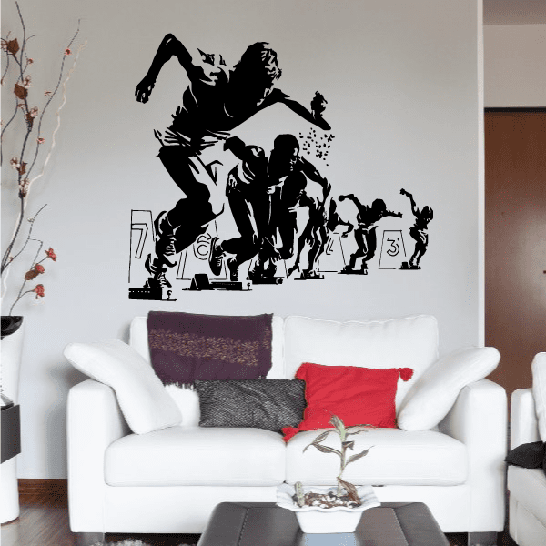 Black wall decal with silhouetted runners at the race start, including number 3