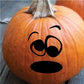 Orange pumpkin face decal with black sad expression