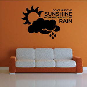 Wall decal: black sun, cloud, raindrops with message 'Don't Miss the Sunshine'