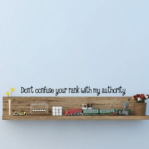 Wall decal with script text: "Don't confuse your rank with my authority"