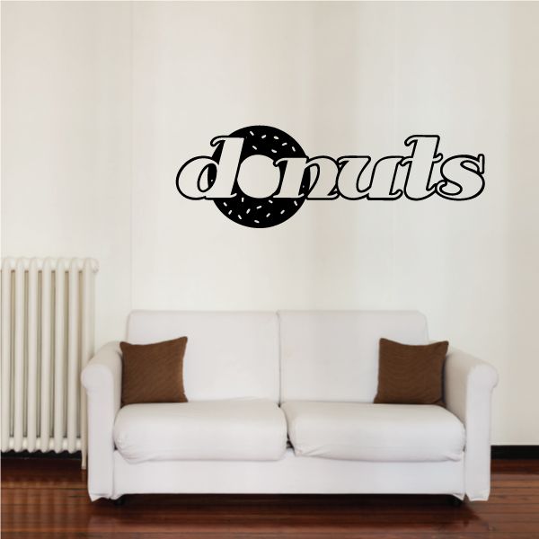 Donuts wall decal with black donut icon and white speckled lettering.
