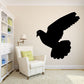 Black pigeon silhouette wall decal with wings spread wide