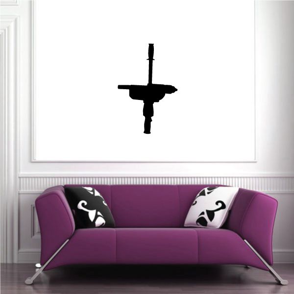 Purple sofa with black and white patterned throw pillows