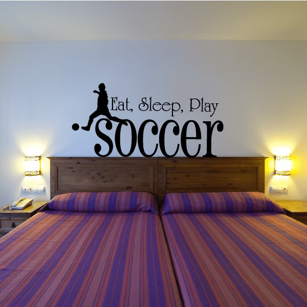 Soccer wall decal with Eat Sleep Play text and player silhouette