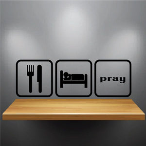 Wall decal with eat sleep pray icons: fork/knife, bed, and “pray” text.