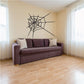 Black spider web and orb extending wall decal with web lines and central hub