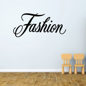 Fashion vinyl wall decal with black cursive lettering on a wall
