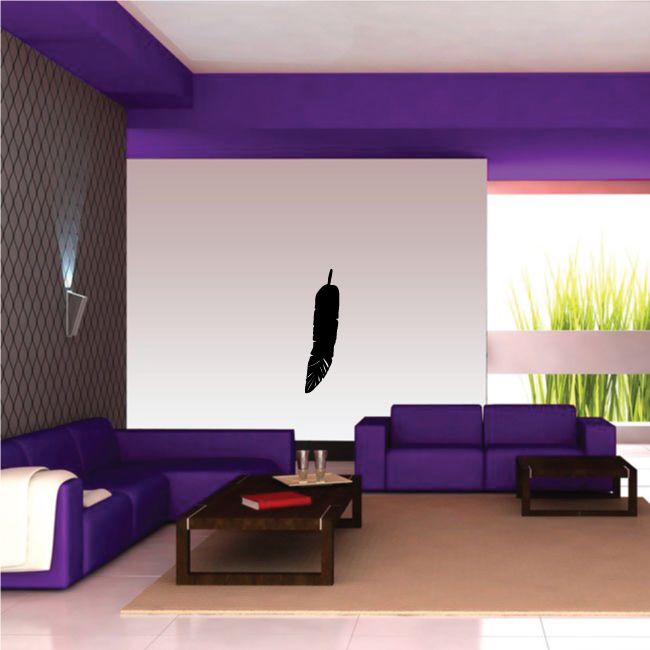 Black feather wall decal on a white wall