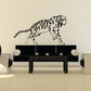 Tiger decal with black-striped outline, facing right on a wall