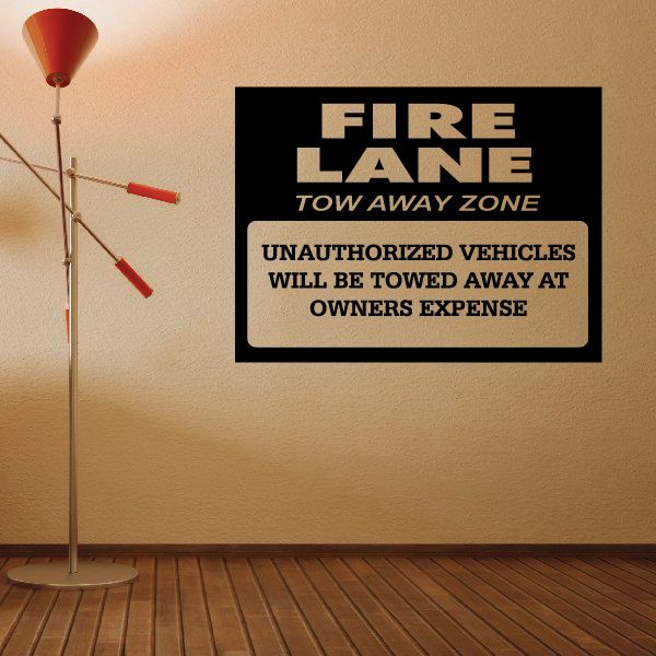 Fire lane tow away zone warning wall decal with red and black text