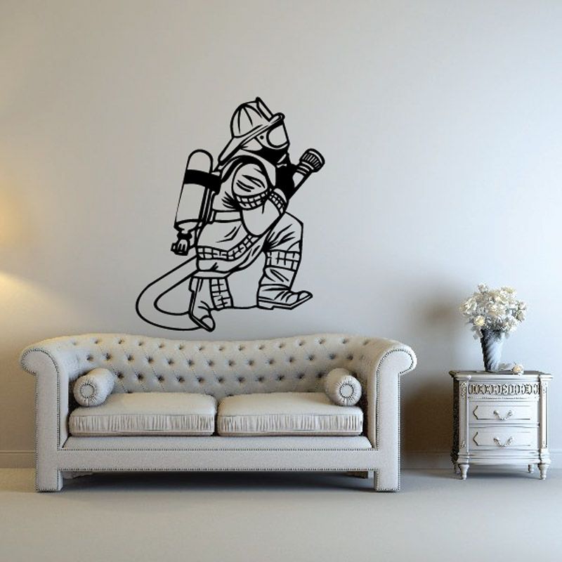 Firefighter decal, black line art of helmeted firefighter holding hose nozzle.